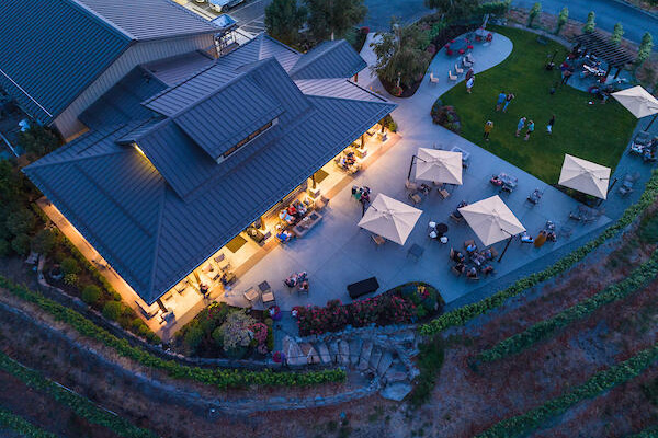 aerial view of winery at night with lights on the patio